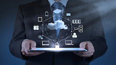 Digital Transformation Services. A man holds a tablet showing 3D images associated with digital transformation