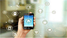 Home Automation. A user holds a phone controlling many IoT devices