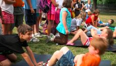IT support for charities - children do sit-ups in a park
