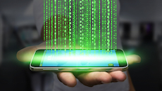 Government sponsored malware. a man holds a mobile phone exfiltrating his data to another location