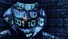 Continuous Vulnerability Management - a shadowy figure is hidden by digital data