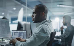 Security as a Service. A security employee works on a service desk